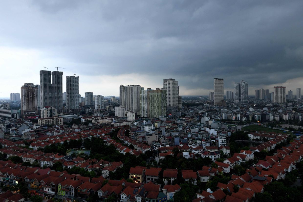 Storm clouds are seen over an urban area in Hanoi on Saturday, June 7, 2025. -- Photo by Tran Thi Minh Ha / AFP