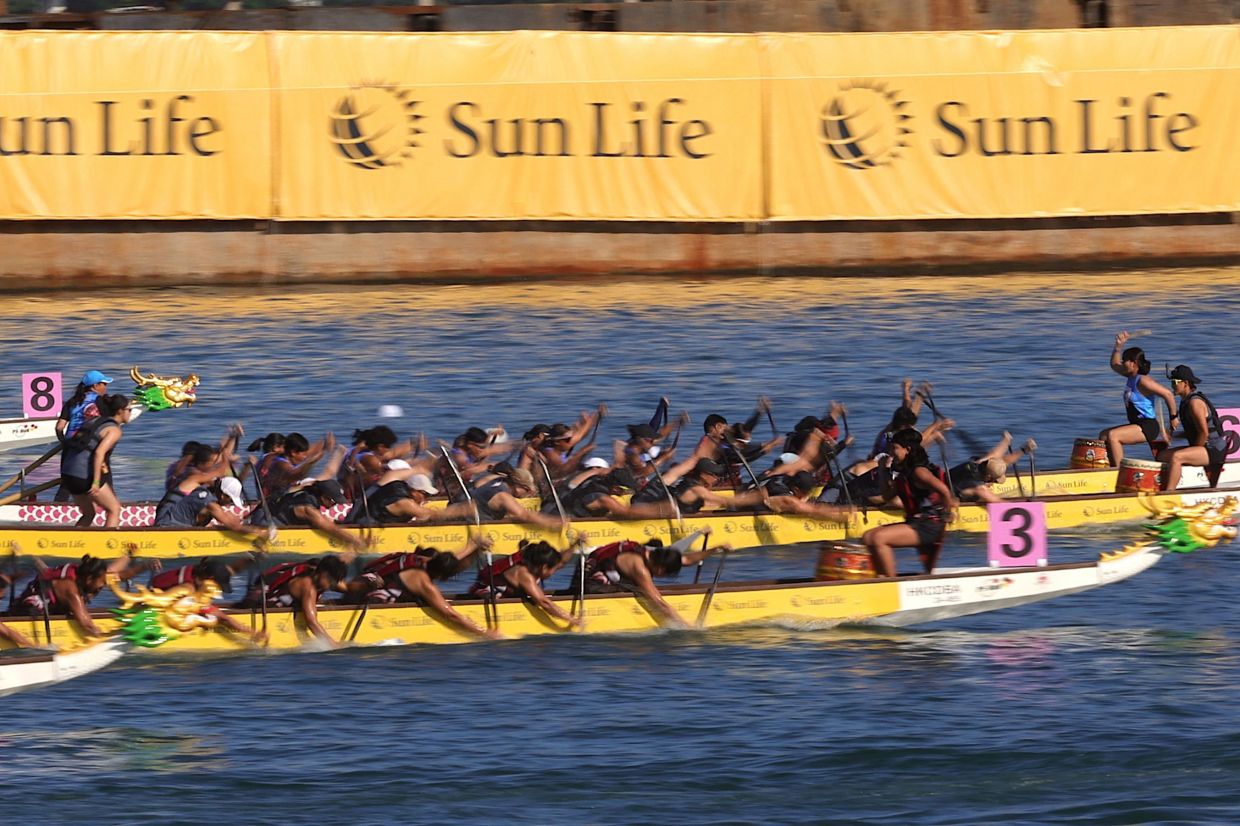 Teams compete during the International Dragon Boat races at Tsim Sha Tsui East Promenade in Hong Kong on Saturday, June 7, 2025. -- Photo by May JAMES / AFP
