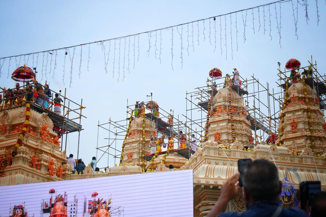 Devotees began streaming into purpose-built tents outside the temple by 7am, waiting eagerly for the main event – a Maha Kumbhabishegam (“grand consecration” in Sanskrit). - Photo: ST 