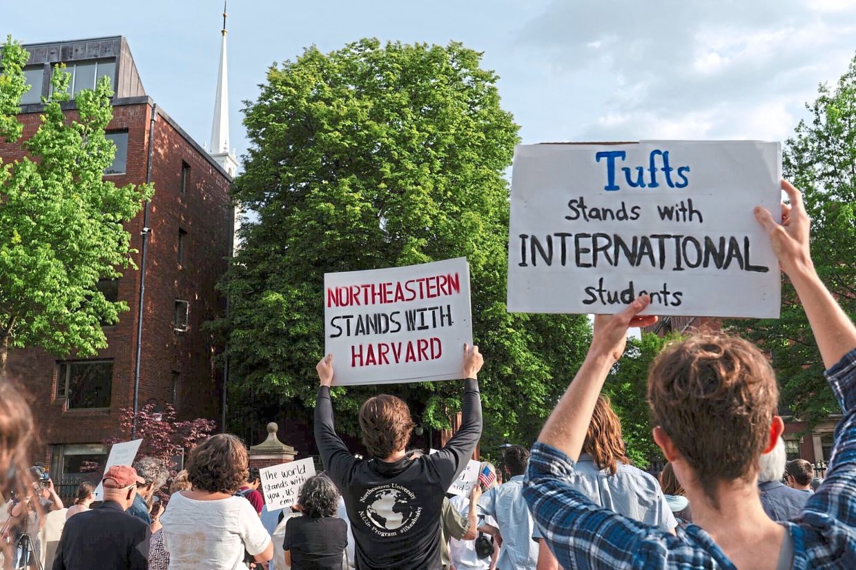 Students of other universities protesting in support of international students at Harvard University. — Bloomberg