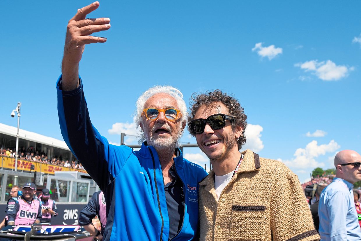 Briatore taking a selfie with former MotoGP rider and compatriot Valentino Rossi at the Enzo and Dino Ferrari racetrack in Imola, Italy, on May 18. — AP