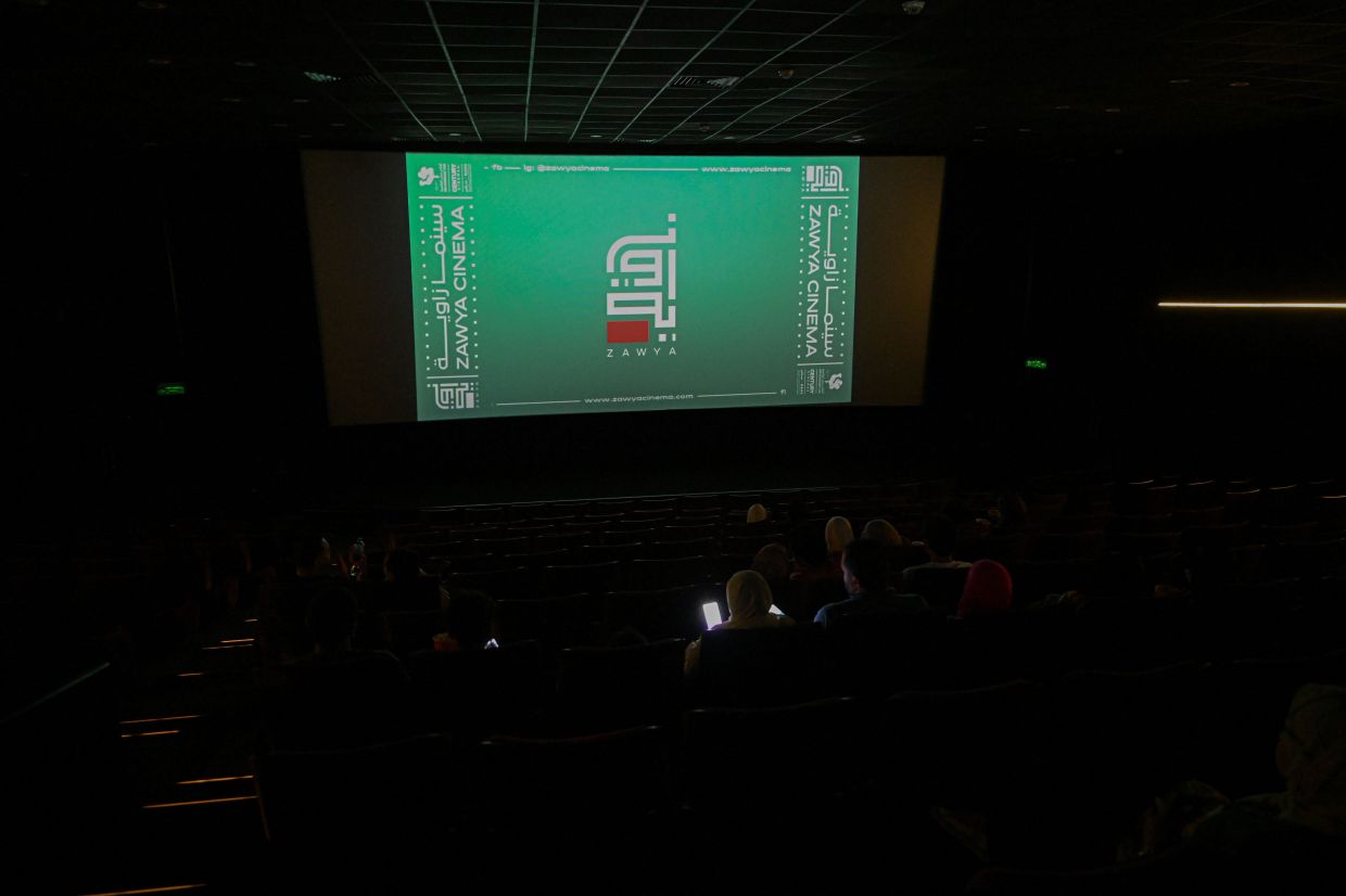 People wait for a movie to start at the Zawya cinema in downtown Cairo. Photo: AFP 