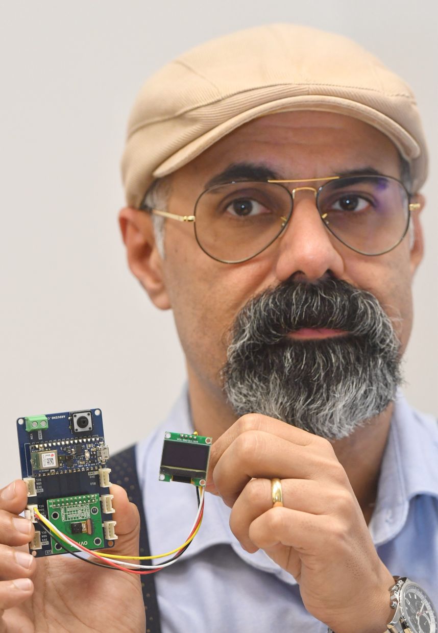 Behjati with part of the device that will help monitor hornbills in Malaysia's dense, difficult to penetrate jungles. — ONG SOON HIN/The Star