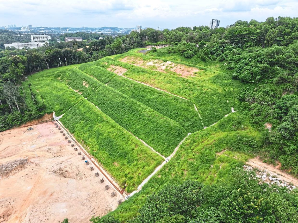 The regreened, rehabilitated dumpsite at Twin Palms in Sungai Long, Kajang. A RM2mil allocation was used to remove toxic debris at the dumpsite which had been in operation on privately owned land for over a decade.