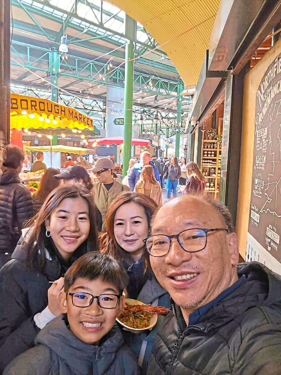 Yin How says his children are his trusted food advisers and the family typically bonds over holidays centred around food. Clockwise from left: Jen, Chan, Yin How and KJ at London's Borough Market. — WONG YIN HOW