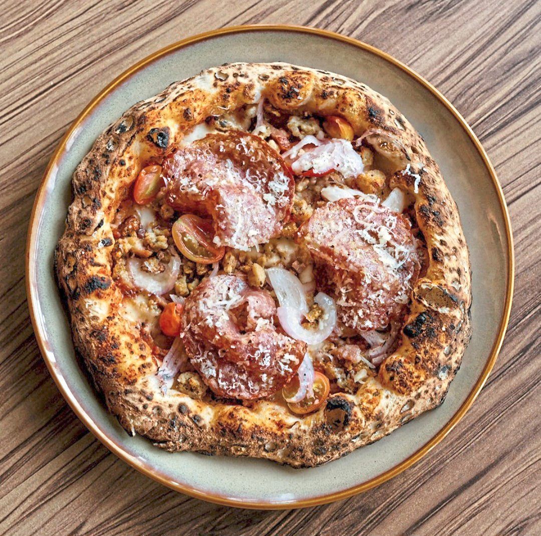 Yin How runs a slew of restaurants like Proof, which has award-winning pizzas (pictured here) and says his children have been instrumental in tasting new additions on the menu and giving him suggestions and feedback. — Proof Pizza/Instagram