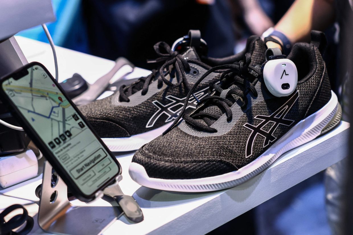 This photograph shows Ashirase's navigation system installed in the shoes at the 9th edition of the VivaTech fair. — AFP