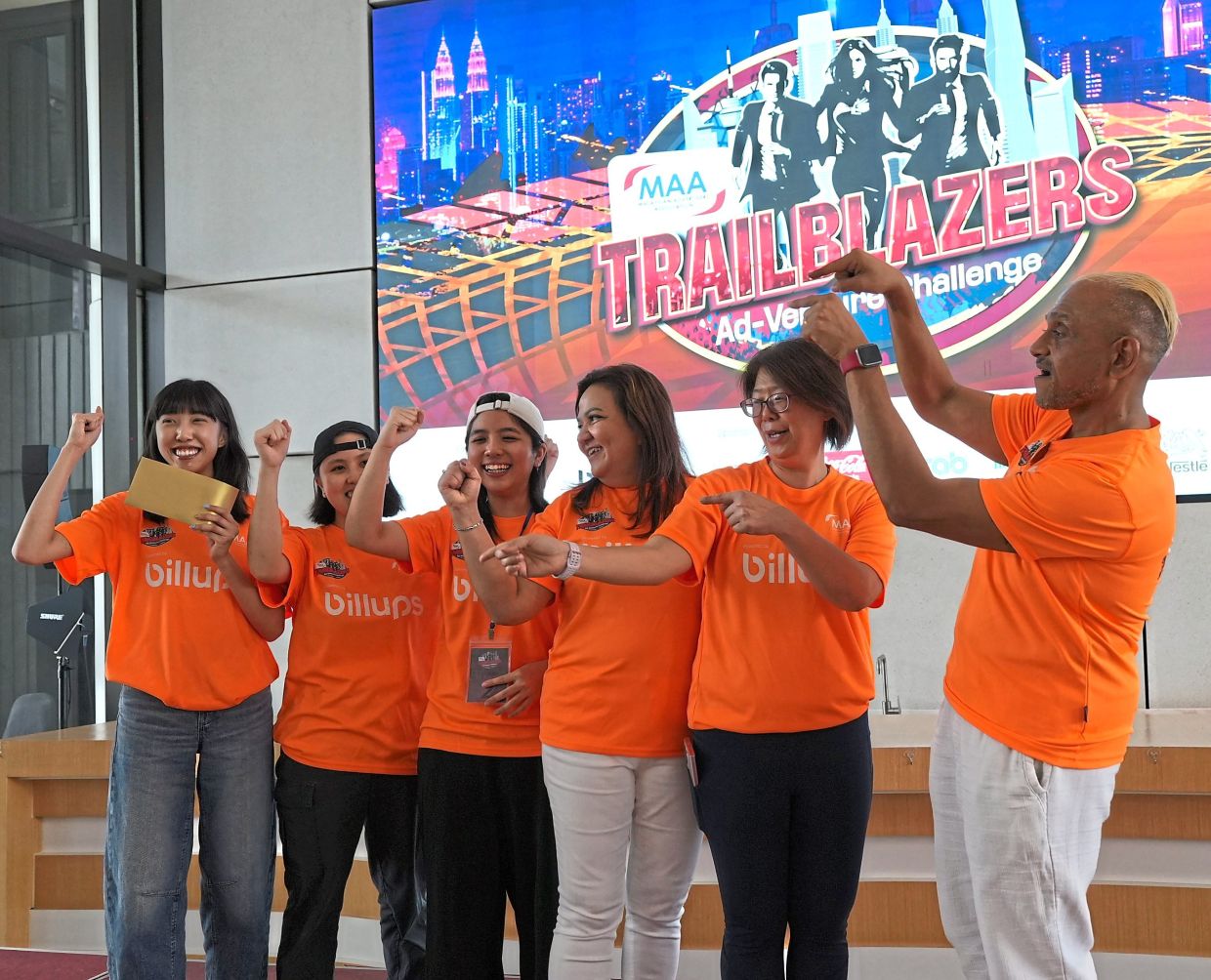 Champs: (From left) Cheah, Yap and Wong celebrating their win with (from right) Claudian, MAA vice president and event organising chair Foong Ai Peng, and Billups managing director (Southeast Asia) Angie Cutter.