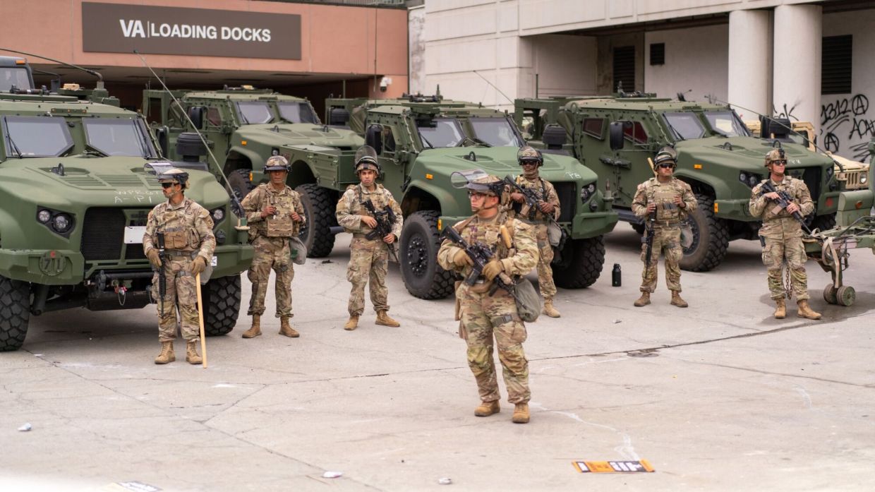 Last Sunday, National Guard soldiers guard outside the Edward R. Roybal Federal Building in LA. — Bloomberg