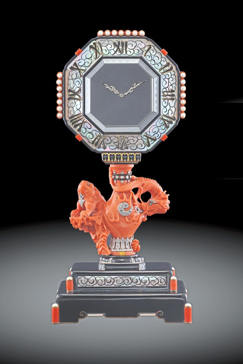 Cartier Unique Mystery Clock with a coral sculpture.