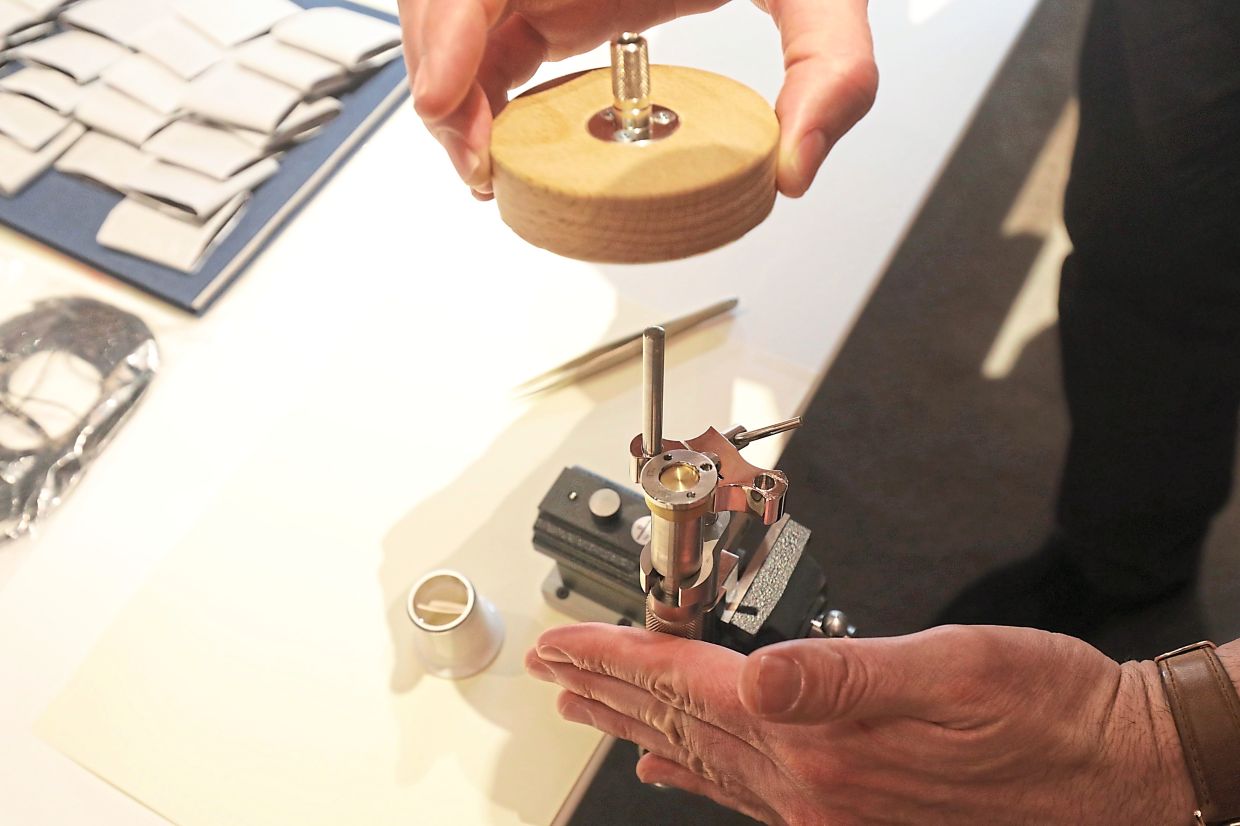 Checking the dimensions of a watch’s raw main plate.