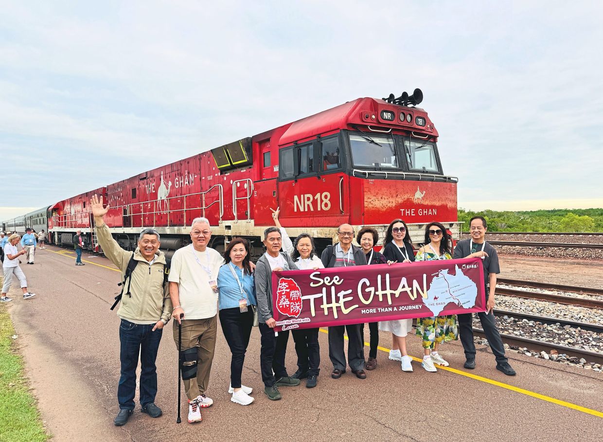 The columnist (far left) with his travelmates before kicking off their railway adventure on The Ghan in Darwin. — Photos: LEESAN