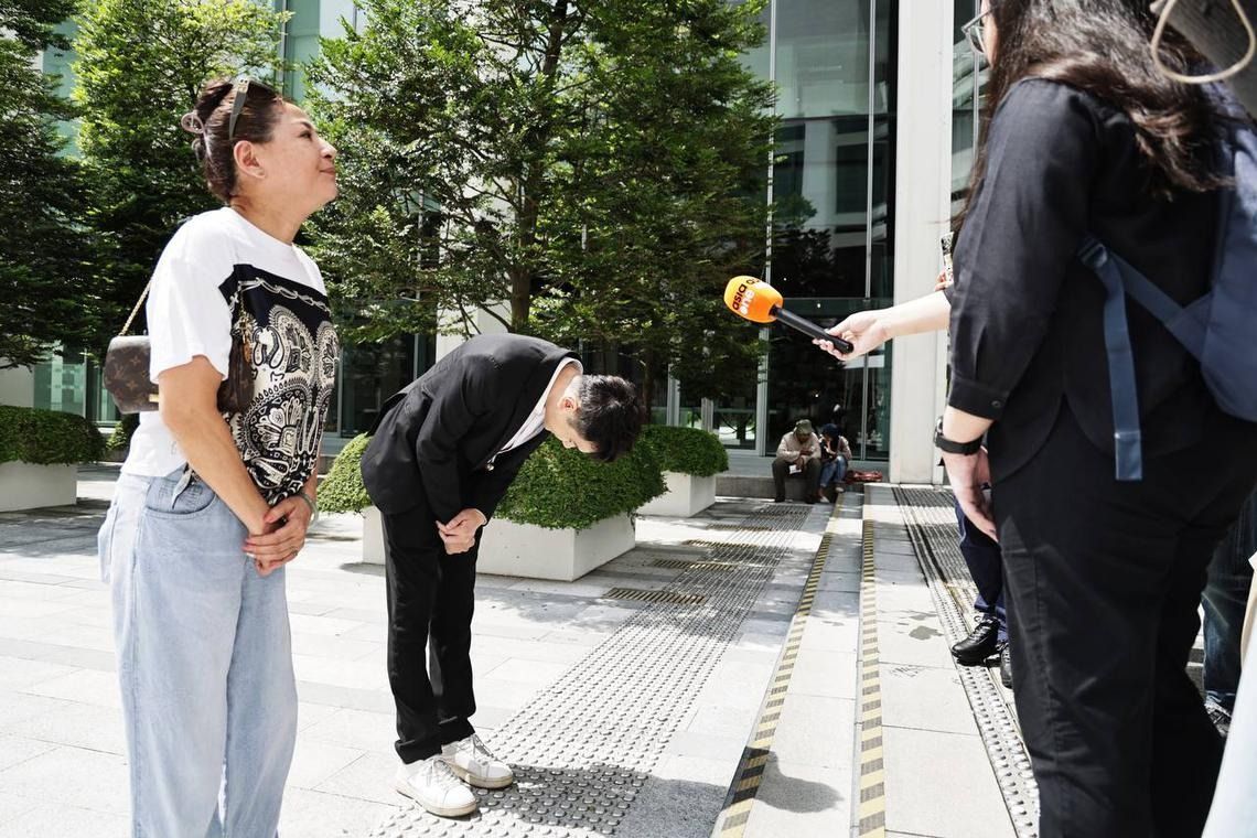 Fang, who was accompanied by a woman identified as his mother, spoke to the media outside the State Courts.- ST