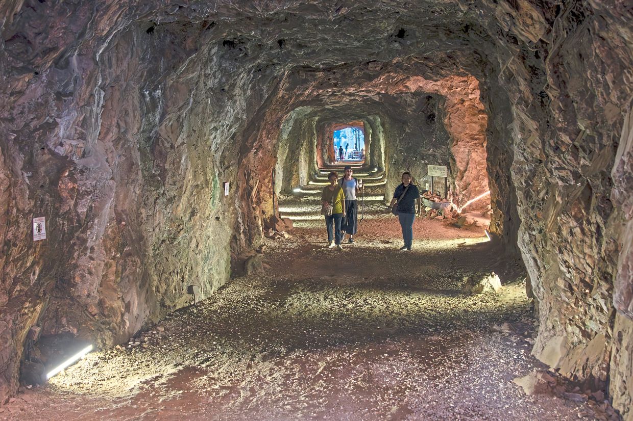 To find the lake, one must walk through the belly of the mountain, an old mining tunnel carved deep into limestone, now a portal into another world.
