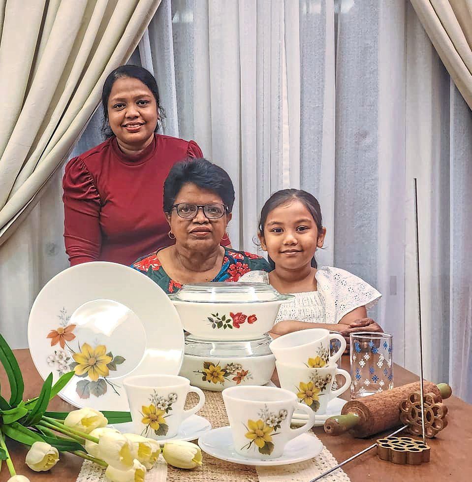 Mary (centre) with some of her treasured collection, together with daughter Rebecca Anne Netto (left) and granddaughter Alyssa Emily Raymond. — MARY MARGARET MIRANDAH