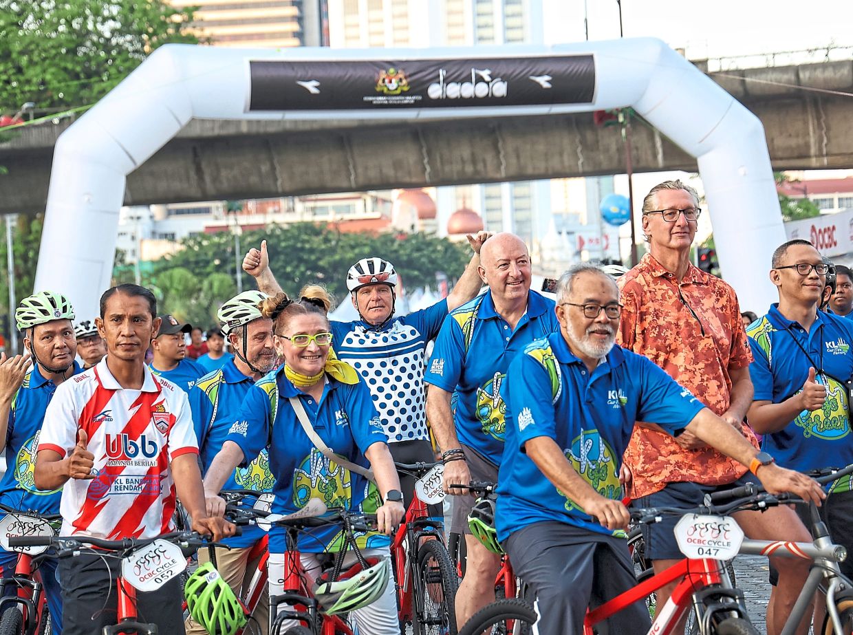Car-Free Morning cyclists on a ride through the city centre.