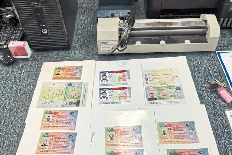 The desktop computer, laptop and printer reportedly used in the process of making fake visas.