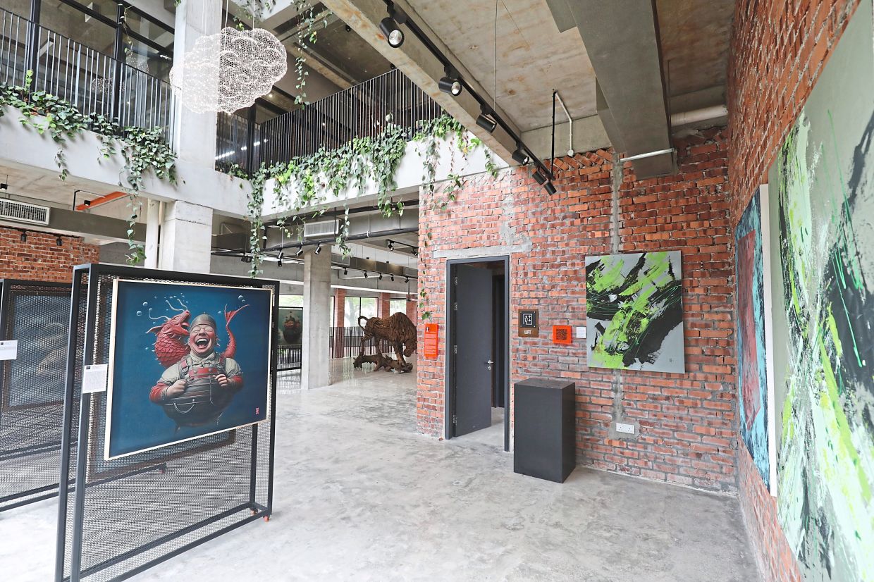 The foyer is converted to an art gallery with a number of paintings on display.