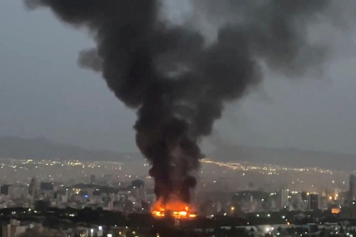 Smoke rising from a fire, as the Israel-Iran air war continues, in Teheran, Iran, in this still image obtained from social media video released on June 17. - Reuters