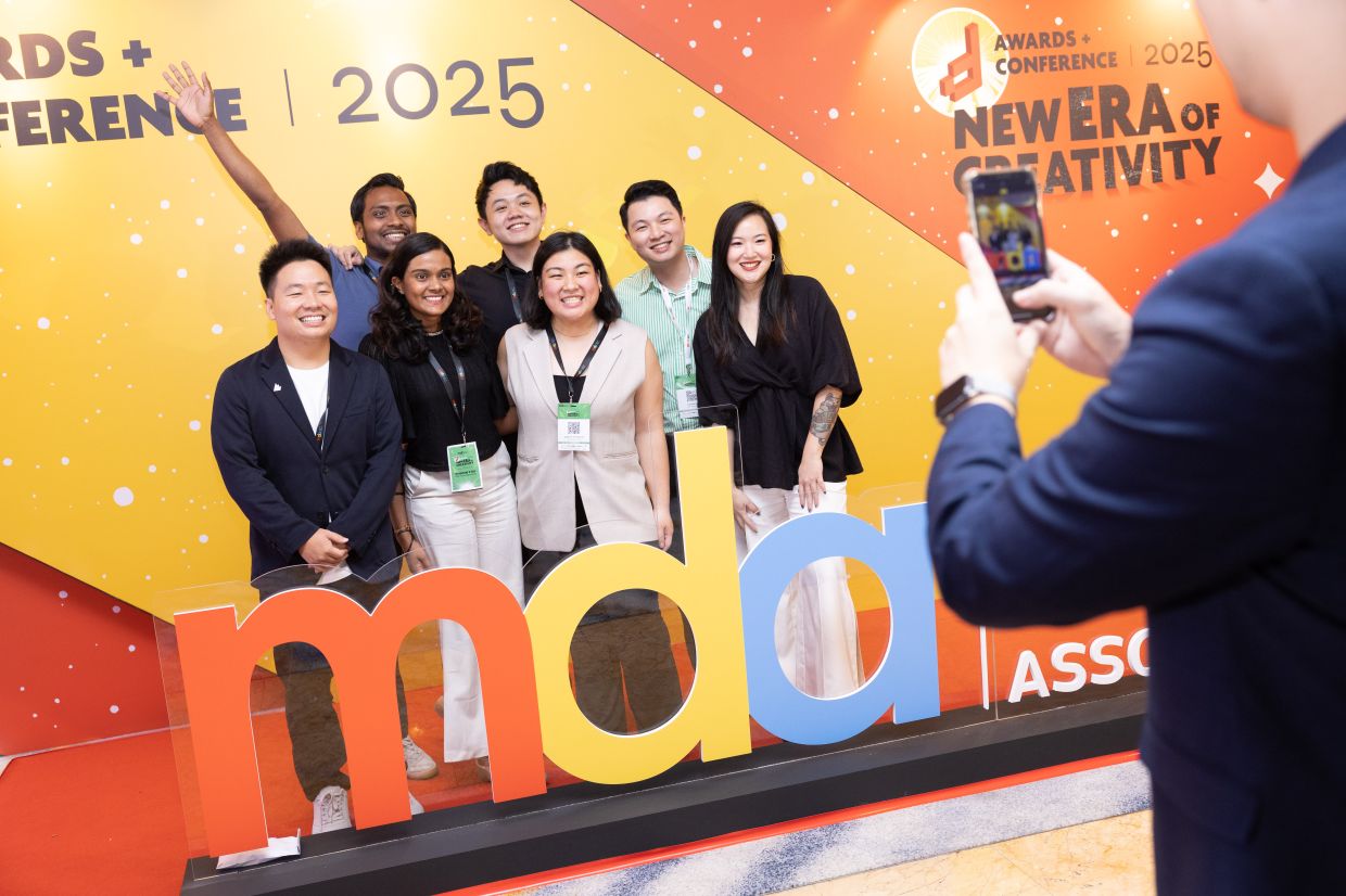Attendees of the d Conference and d Awards 2025 capturing memorable moments at the venue while actively networking and engaging with industry peers.