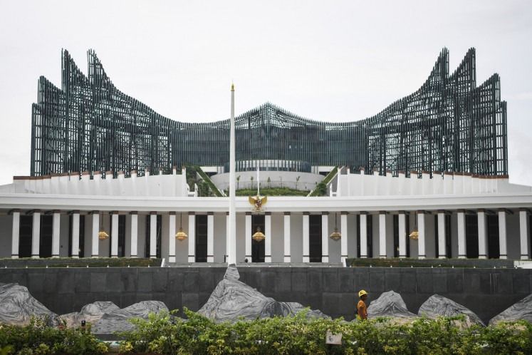 A worker walks in front of the State Palace on Nov. 10, 2024, at the government offices complex in the Nusantara Capital City (IKN) in North Penajam Paser, East Kalimantan. President Prabowo Subianto has said that within the next five years, he will make the new capital city the center of government political activities, where most of his administration’s executive, legislative and judicial activities will take place. - Photo: Antara file