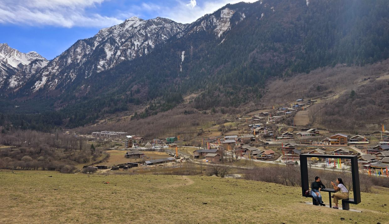 Nearby Zhongcha Village, walk up the hills where the yaks and goats graze and enjoy the view. 