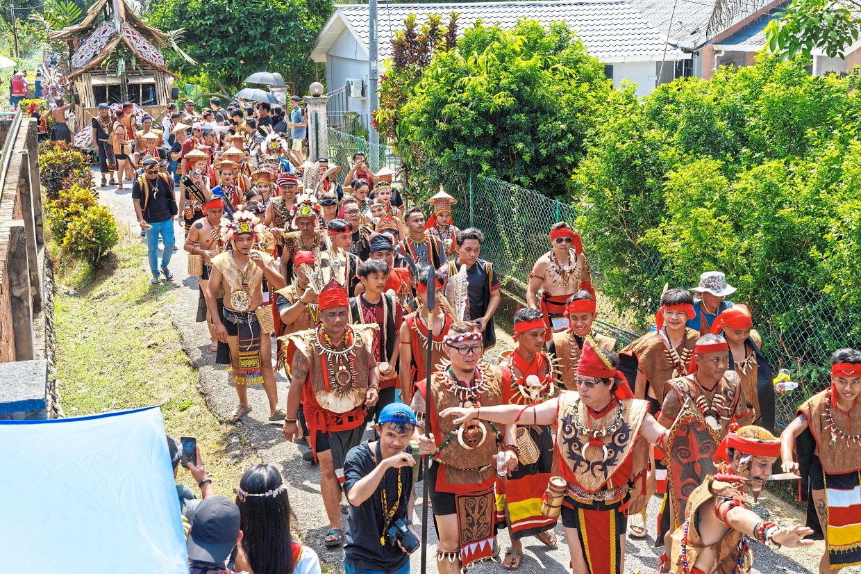 The annual Gawai parade at Kampung Taee was a colourful showcase of Bidayuh culture. - ZULAZHAR SHEBLEE/The Star