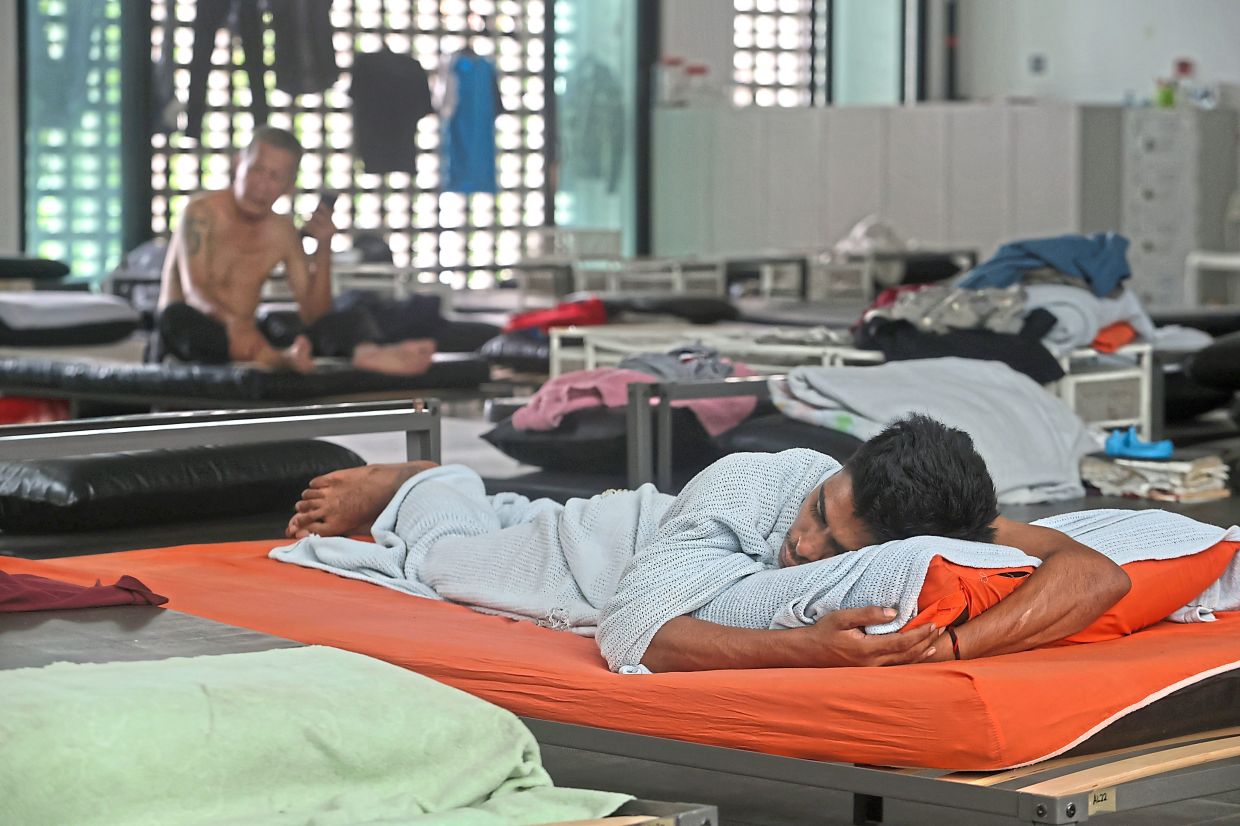 Residents resting at the transit centre in Jalan CY Choy in George Town.