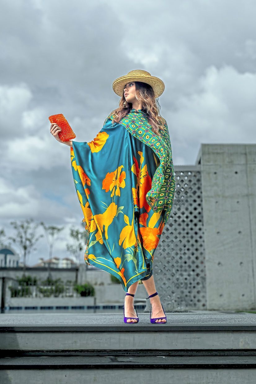 This dress from is a fun, expressive statement piece, with a vibrant mix of blooms and bold tones. Photo: Yacutha