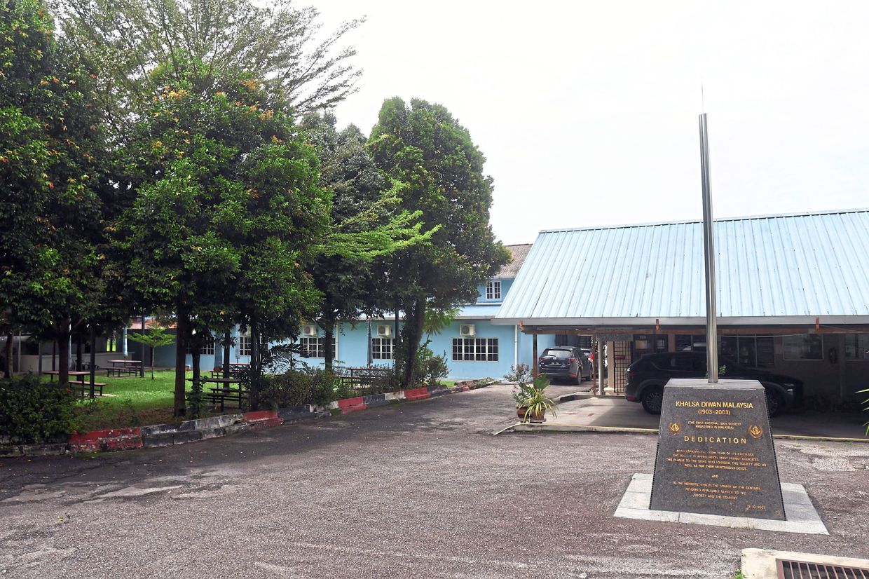 Part of the Khalsa Diwan Malaysia office building with a centennial commemorative stone, which recognisesKDM as the first national Sikh society registered in the country. Classes for the Punjabi education programme are held on the premises every Saturday. — Photos: RONNIE CHIN/The Star