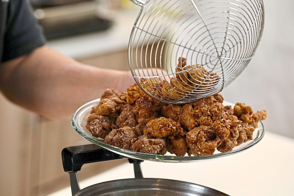 It only takes three to four minutes to fry until crispy a batch of marinated chicken dredged in batter.