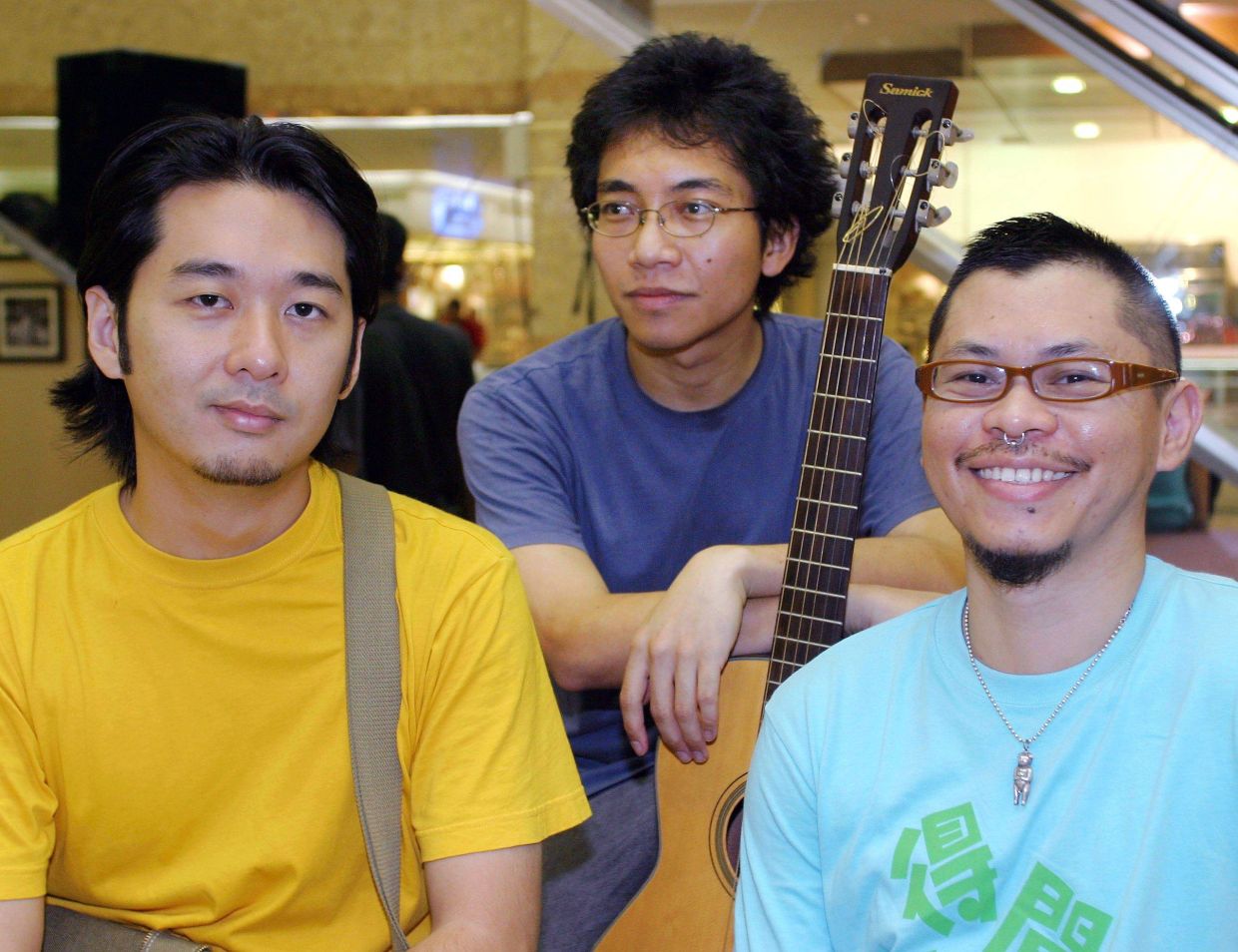 In this 2005 photo, the KL Sing Song founding trio (from left) - Tan Sei Hon, Azmyl Yunor, and Jerome Kugan - came together under Troubadours Enterprise to give 'outsider voices' a space to shine. Photo: Filepic/The Star 