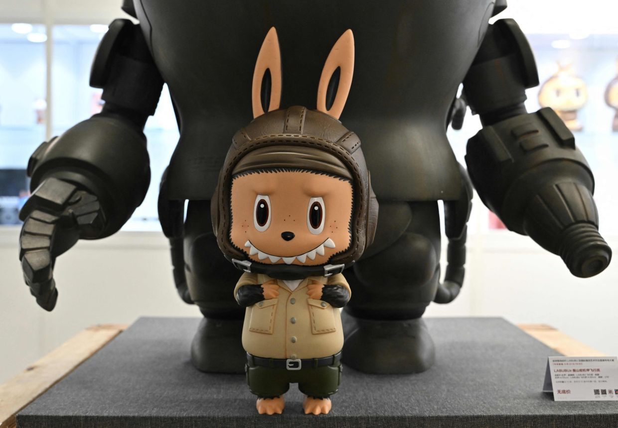 A limited edition of a Labubu figure called Labubu Pilot in Beijing on June 20, 2025, ahead of an auction by the Yongle Auction house on June 22. (Photo by Adek BERRY / AFP)