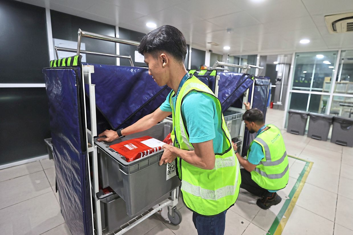 Parcels being sorted at Putra Heights LRT station. 