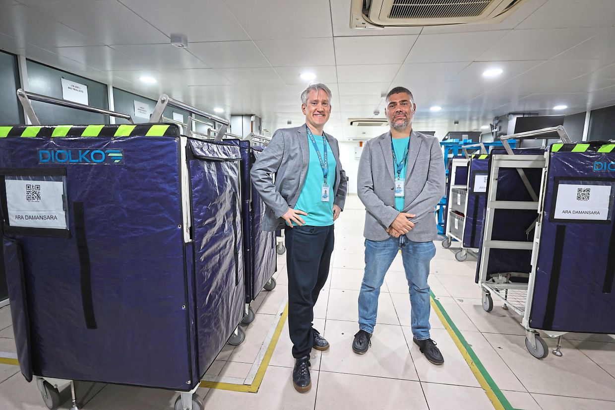 Pfeiffer (left) and Gueguen at Diolko’s hub at Putra Heights LRT station.