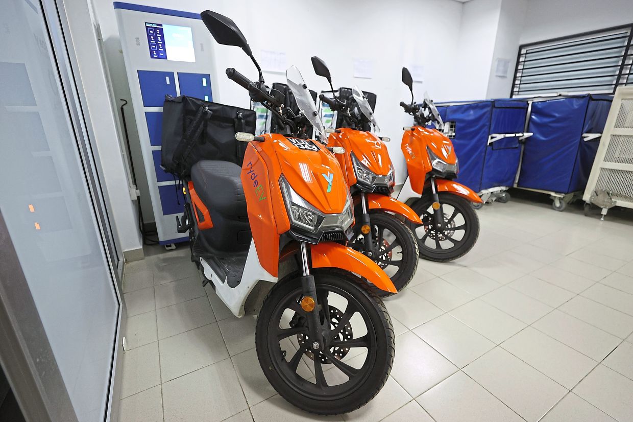 Electric motorcycles used for last-mile delivery at Ara Damansara LRT station.
