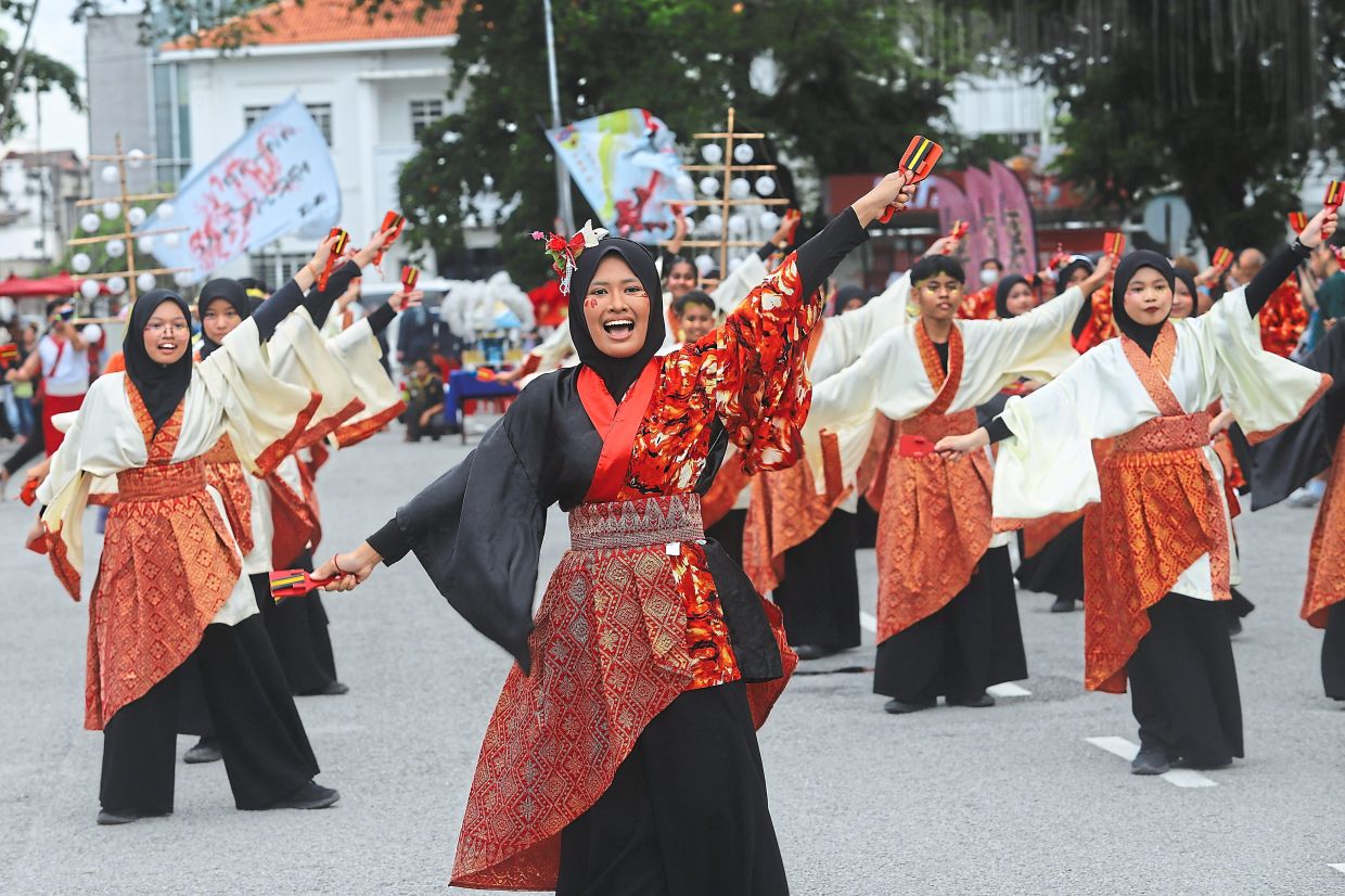 Participants add creative touches by incorporating local fabric and reinterpreting traditional outfits.