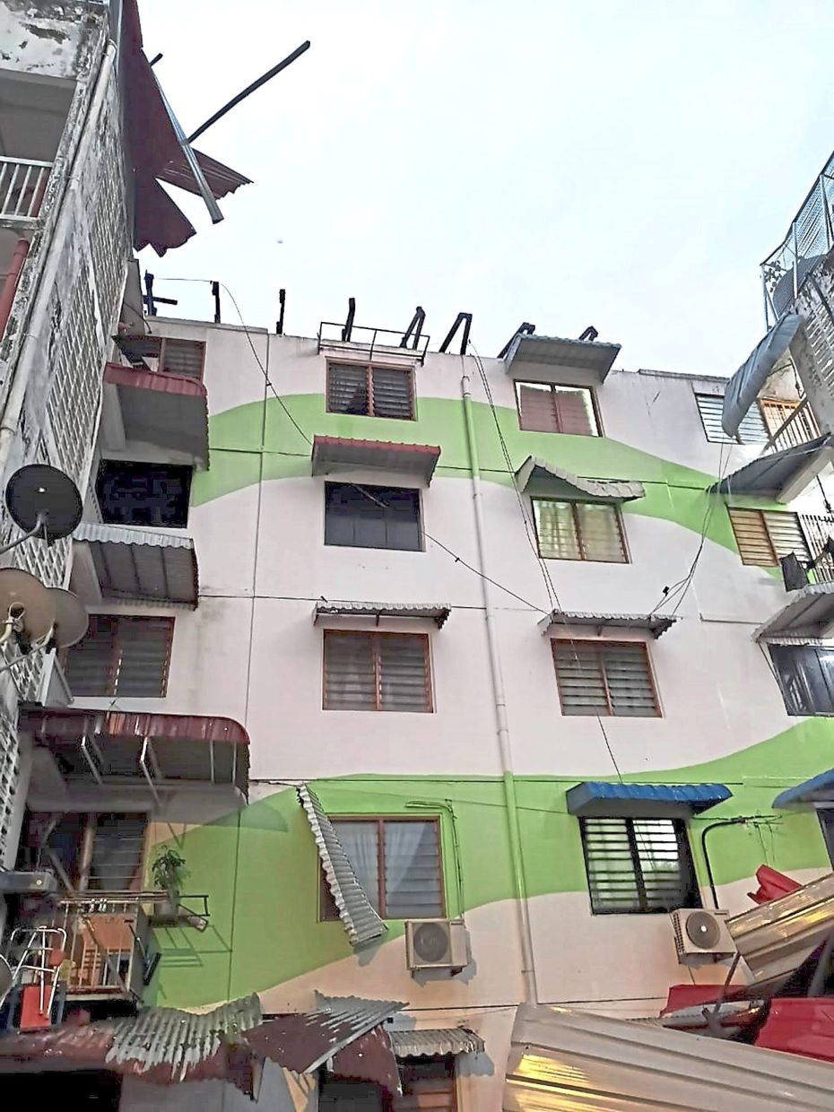 The roof of a flat in Taman Tun Sardon (left) was blown away during the storm that hit the area at 4.30am. — Photos courtesy of MBPP