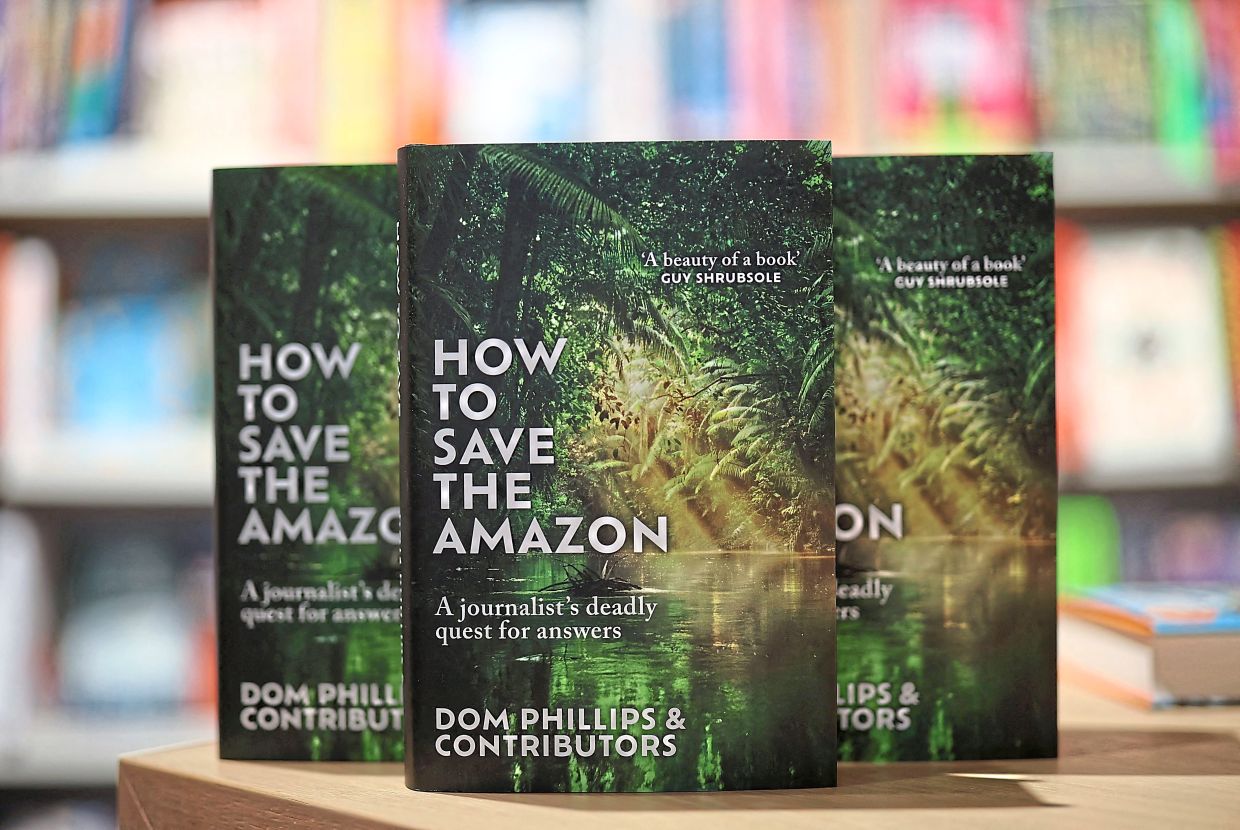 Copies of the book ‘How to Save the Amazon’ by Dom Phillips & contributors for sale inside a bookshop in central London on June 6, following its launch. — AFP