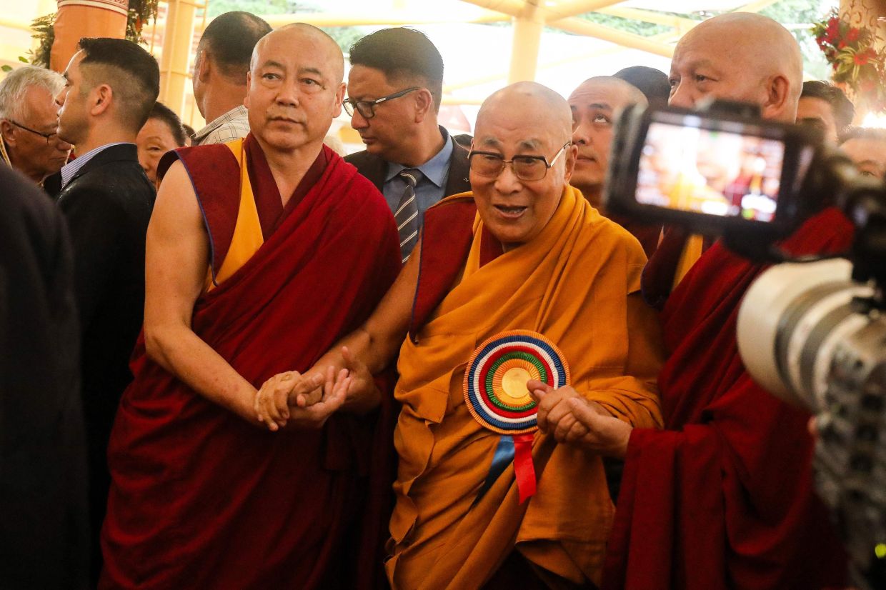 Tibetan spiritual leader the Dalai Lama (right) arrives to attend a Long Life Prayer offering ceremony at the Main Tibetan Temple in McLeod Ganj, near Dharamsala on Monday, June 30, 2025. Exiled Tibetan spiritual leader, the Dalai Lama, gave on June 30, the strongest indication yet that the 600-year-old institution would continue after his death, at prayer celebrations for his 90th birthday. The leader, who turns 90 on July 6, is according to Tibetans the 14th reincarnation of the Dalai Lama. - Photo by Sanjay BAID / AFP