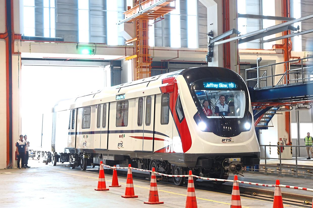 Moving colours: The RTS Link four-car train set has a white livery with red and blue accents – inspired by the colours of the Malaysia, Johor and Singapore flags. — THOMAS YONG/The Star