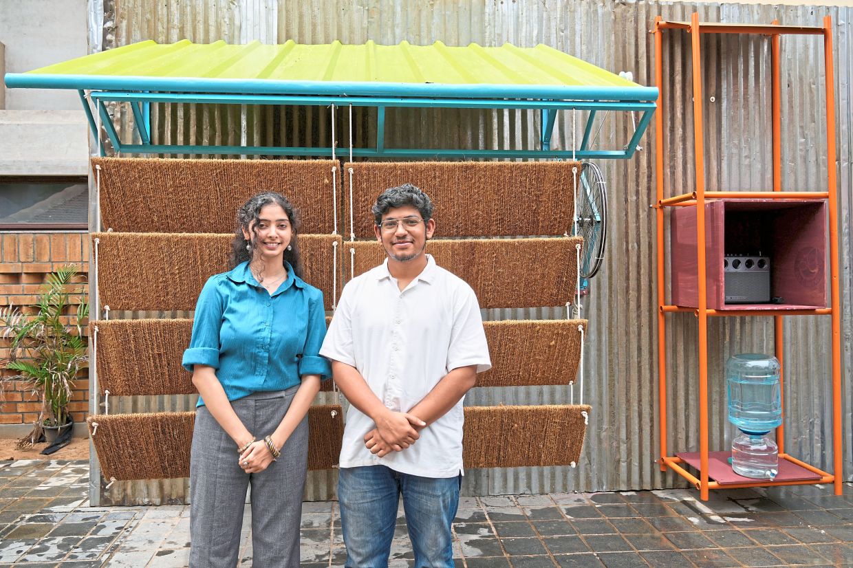 Diggavi and Kandal, the architects behind the design of Neralu, which costs about US$175 and is made of metal, fibre-reinforced plastic and plywood. — AP