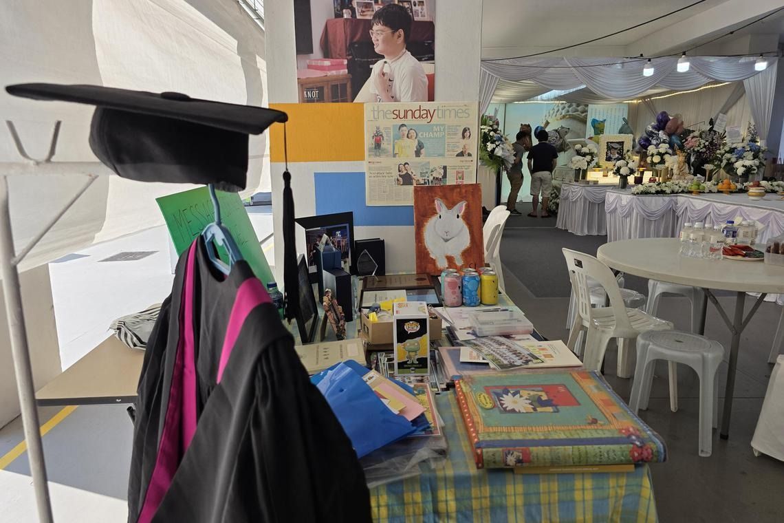 A memorial corner at Samuel Lim's wake, decorated with items including his master's degree plaque androbe. - Photo: ST 