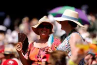 Tennis-Fans take cover on hottest opening day in Wimbledon history