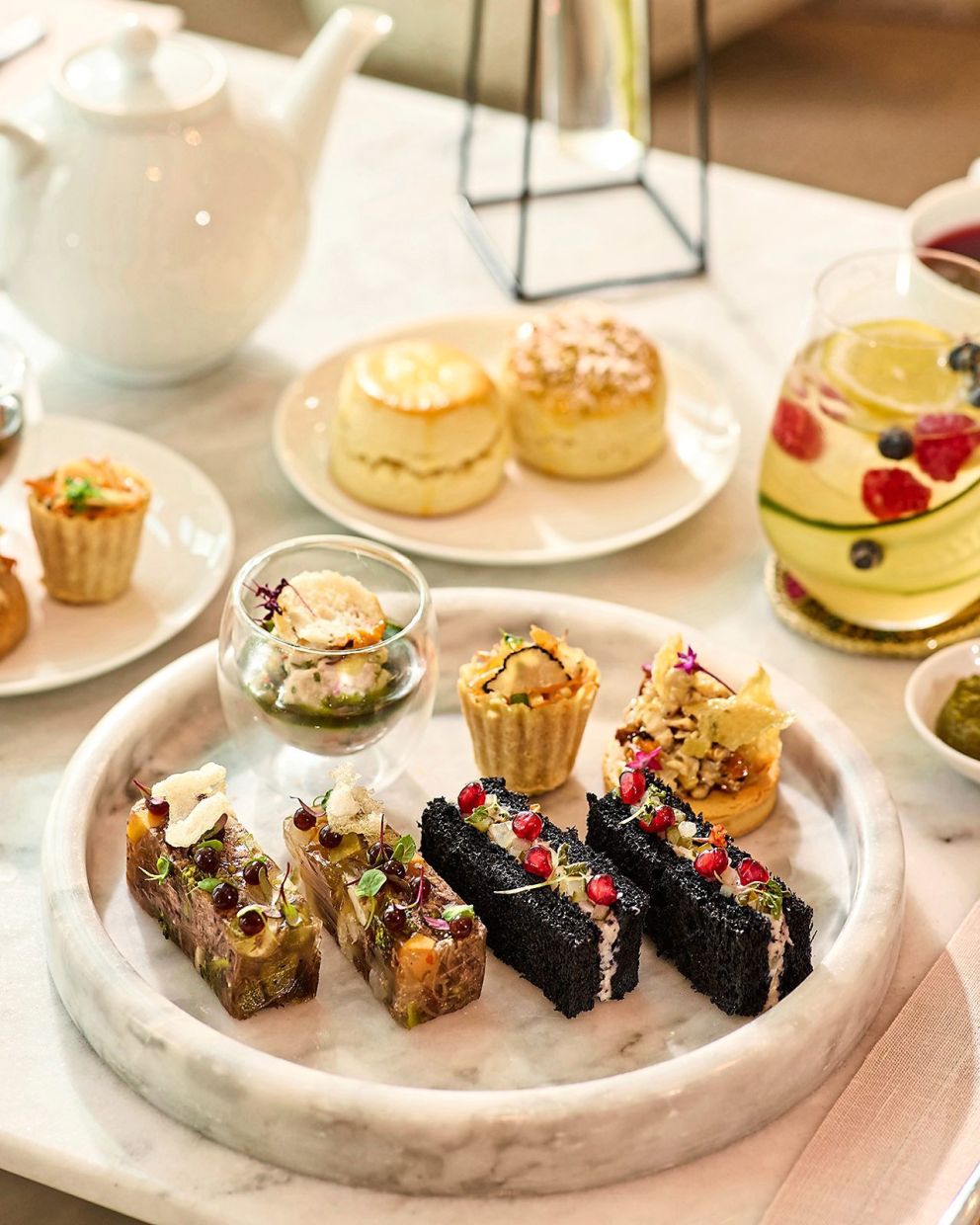 The platter of savouries consists of (front row, from left) Jellied Beef Short Rib Terrine and Smoked Coconut Husk Mackerel.