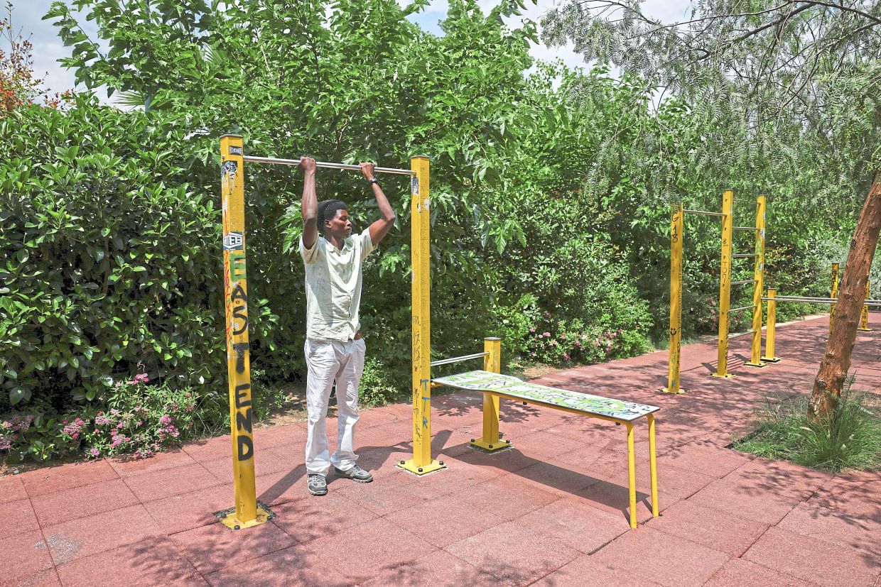 Yakoub exercising at an open park in Athens after giving an interview. — Reuters 