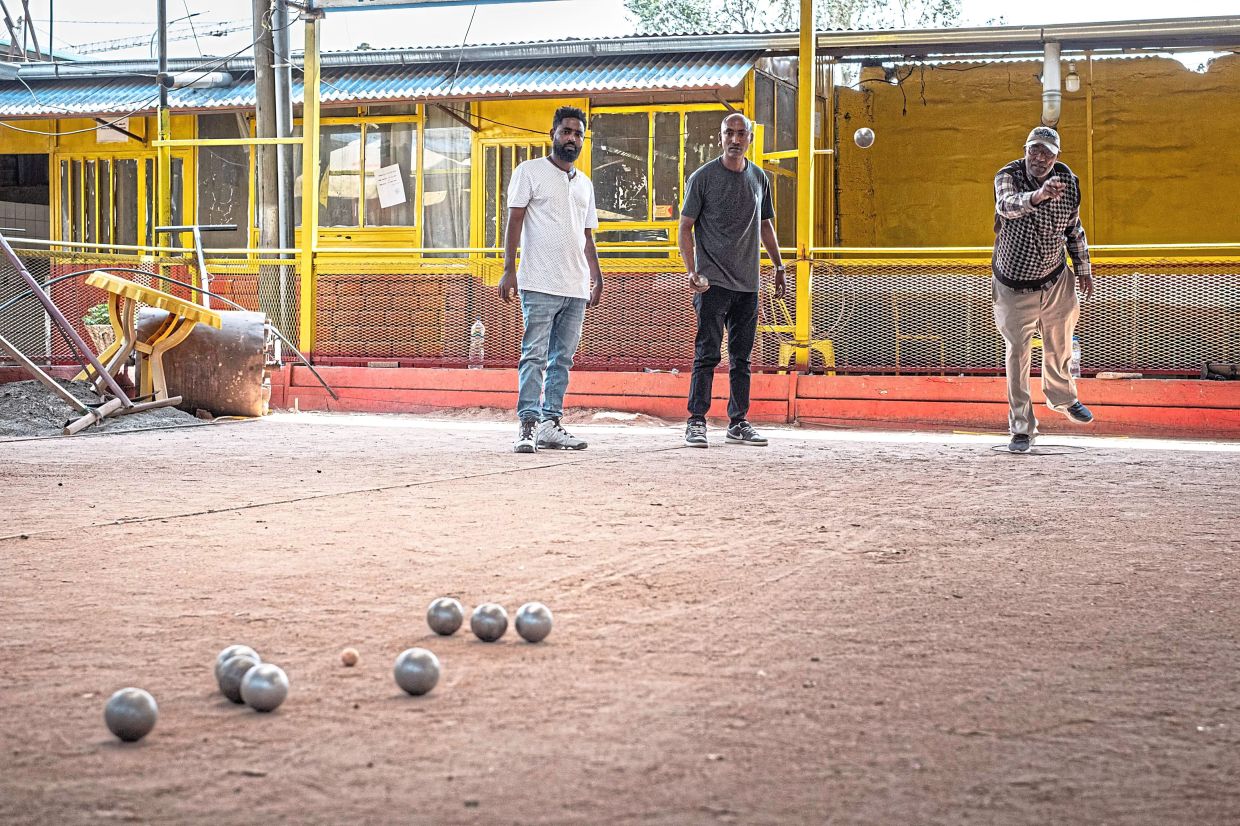 Club members play a match of petanque at the Club des Cheminots.
