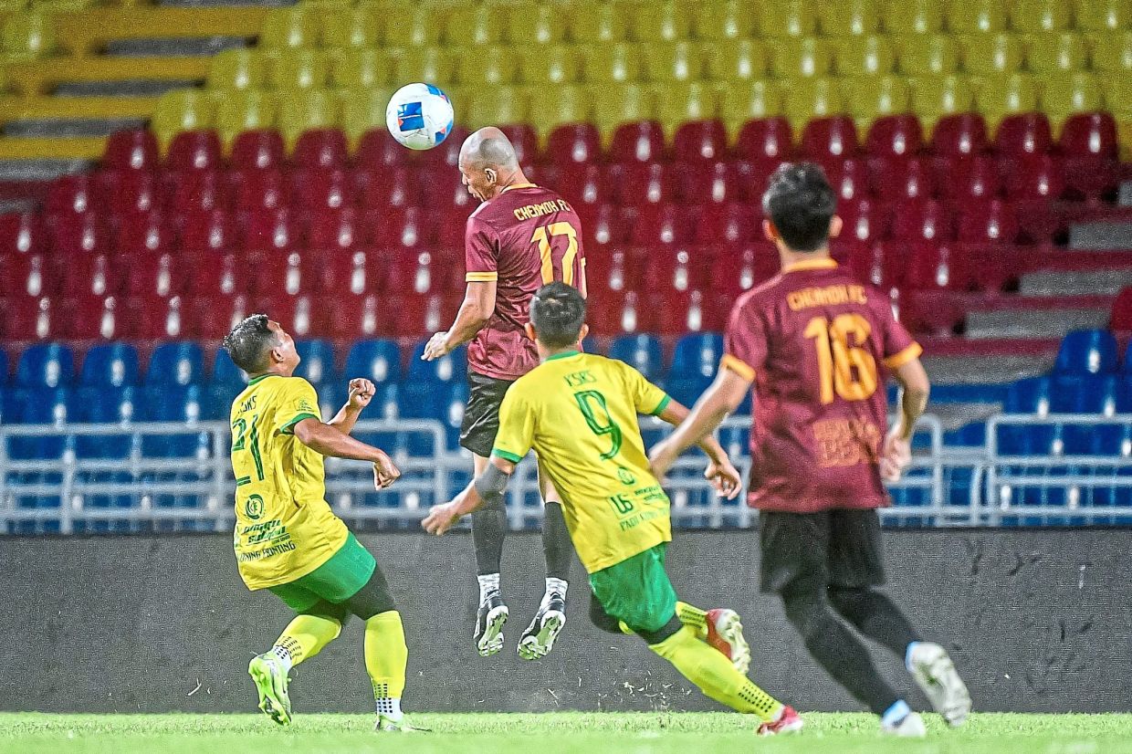 Chenmoh FC taking on KSR Seratarata on their way to winning the Mayor’s Cup football tournament.
