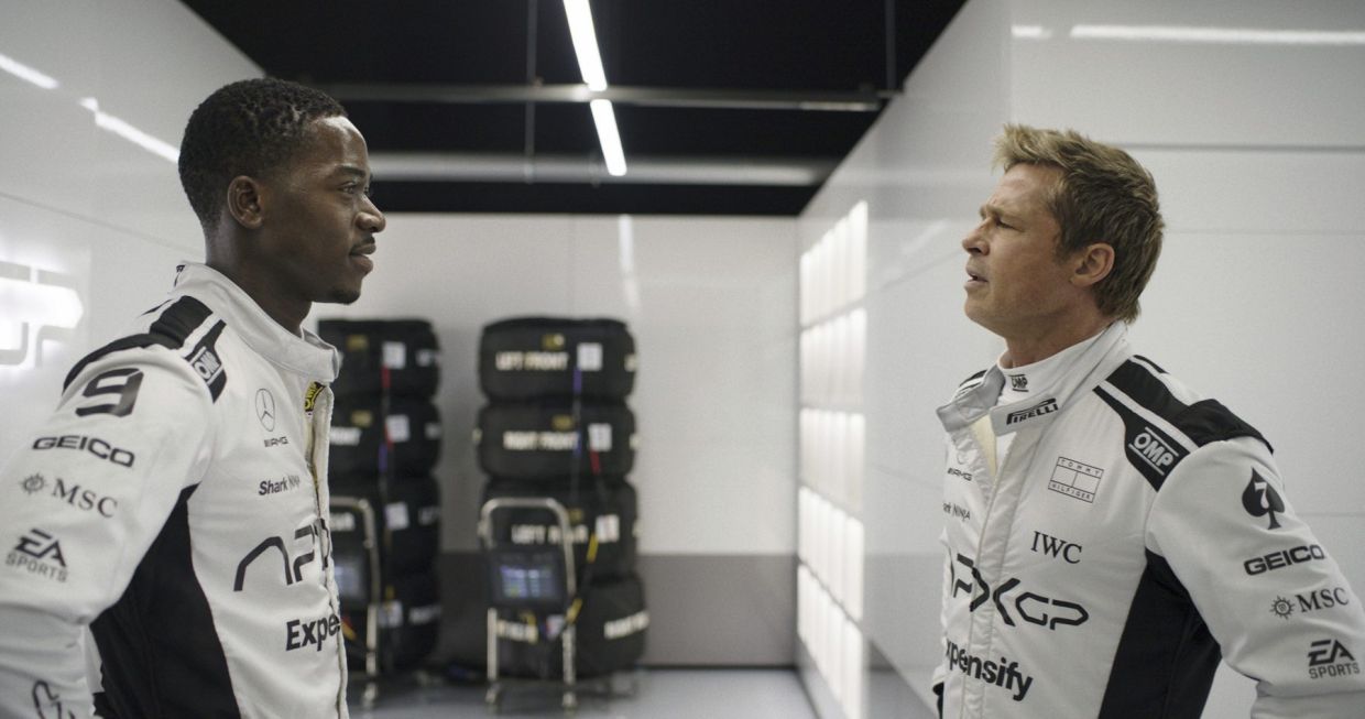 Damson Idris as Joshua Pearce, left, and Brad Pitt as Sonny Hayes in a scene from 'F1 The Movie.' — Apple TV+ via AP