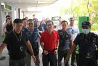 Sengkang murder: Man accused of killing elderly mother escorted back to crime scene